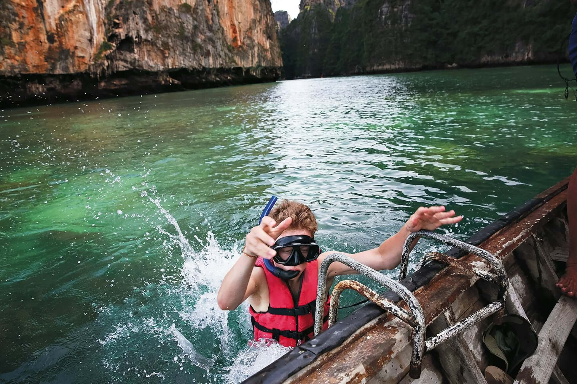 Snorkeling adventure in Thailand's clear waters, showcasing marine conservation efforts for student travel in summer.