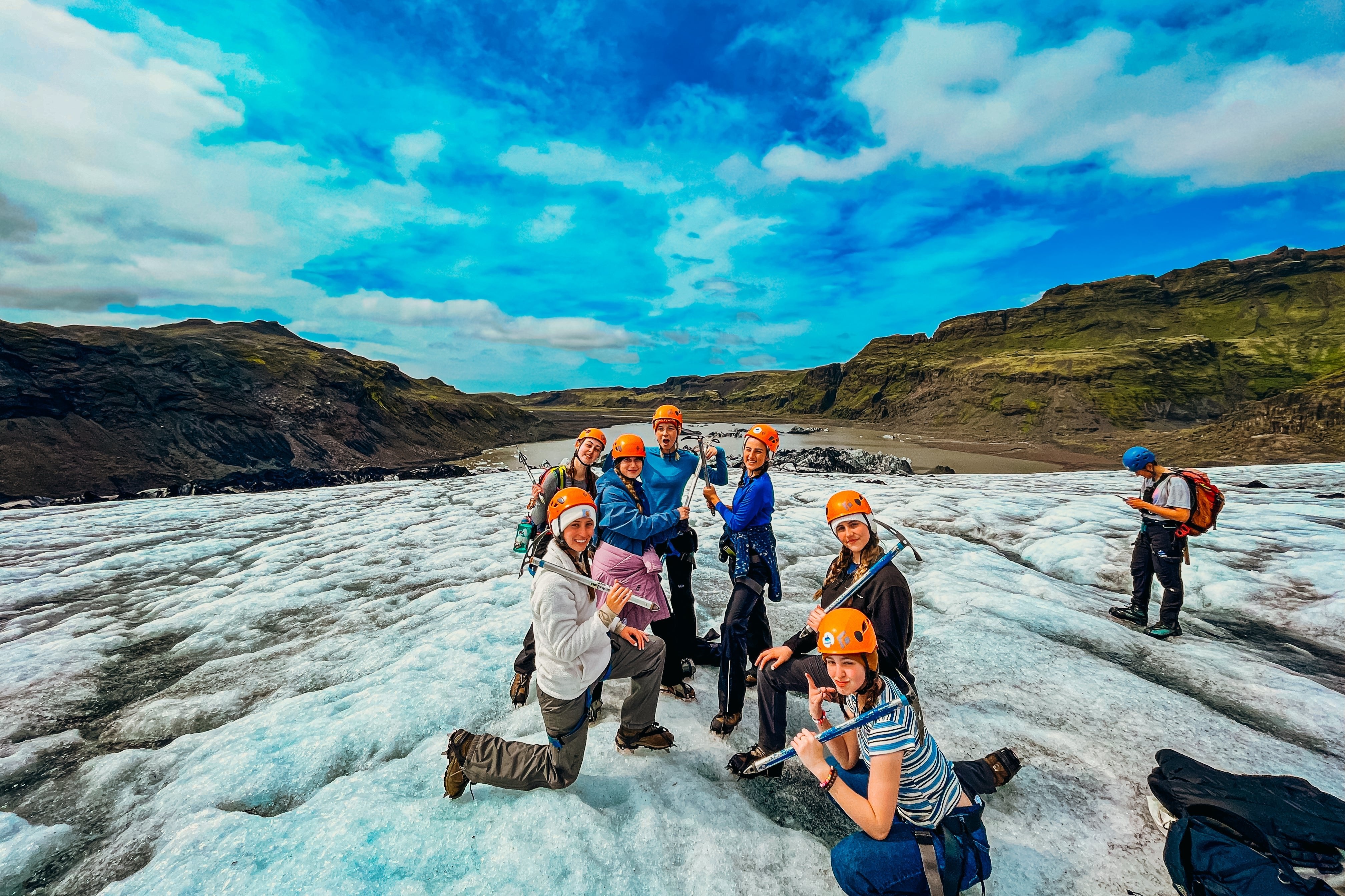 Group of high school students on a glacier in Iceland, enjoying summer programs and teen travel adventures.