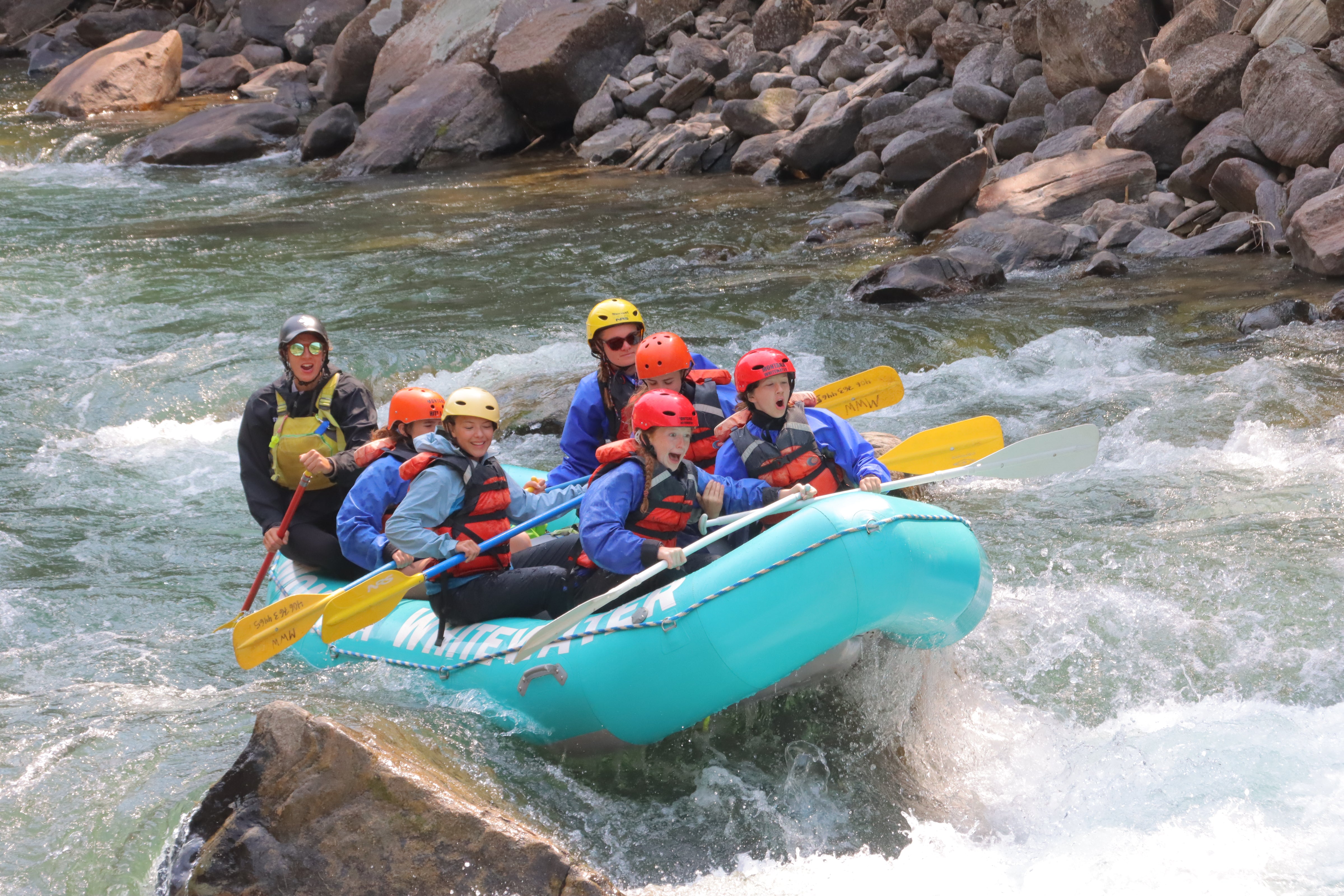 youth rafting adventure at Alpengirl Camp Summer 2025, showcasing teamwork and excitement on the river.