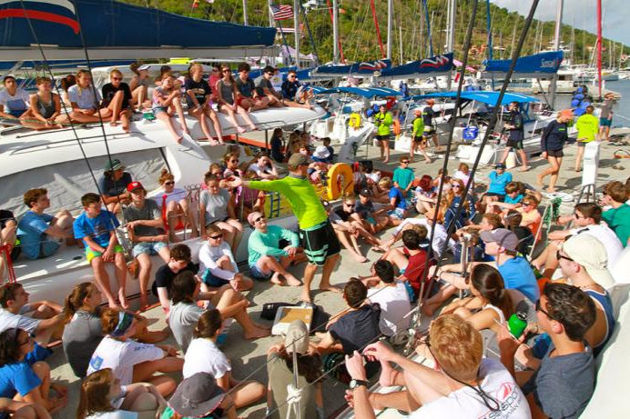 Teens engaged in sailing activities at ActionQuest summer camp in the British Virgin Islands, fostering teamwork and adventure.