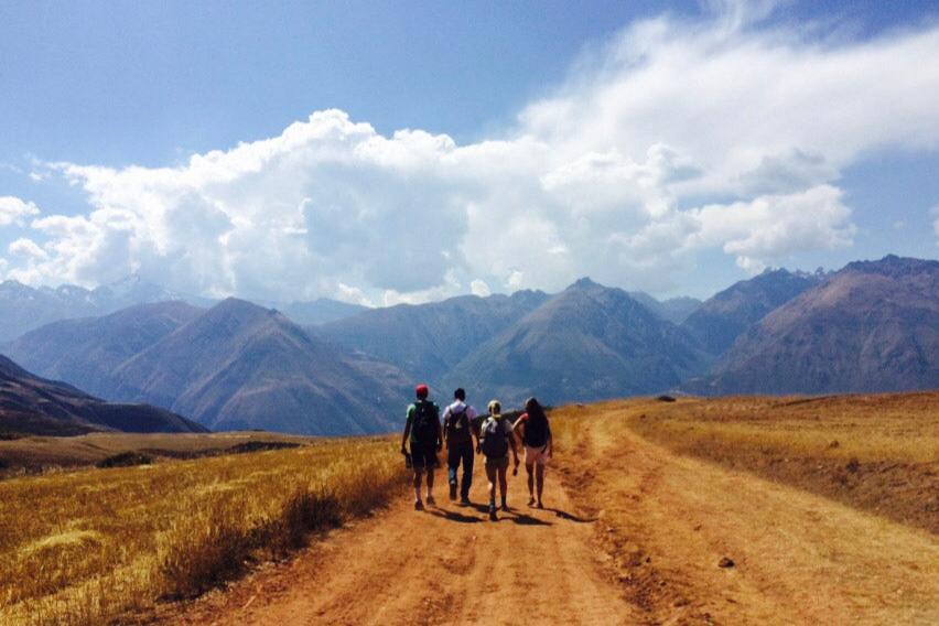 Group of teen travelers hiking in the Andes mountains during a summer program in Peru.
