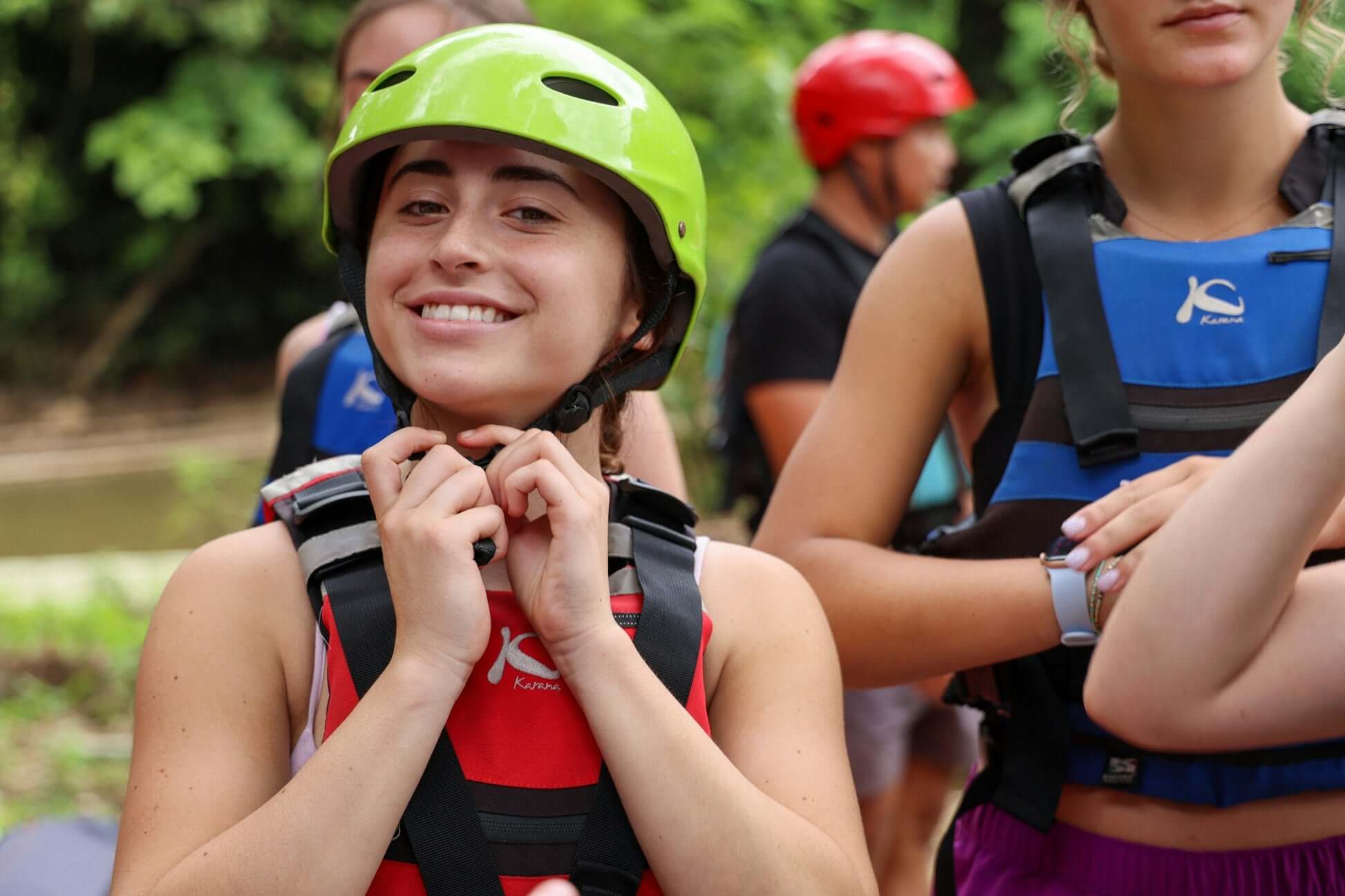 High school student smiling and preparing for an adventure in northern Thailand, ready for rafting and outdoor fun.