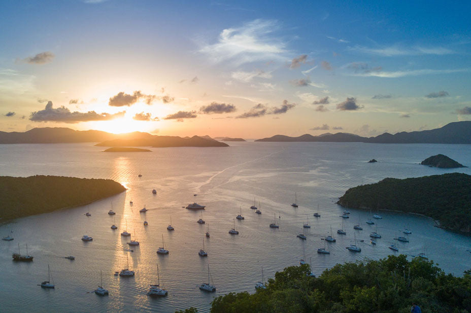 Sunset over the Caribbean with boats anchored in the British Virgin Islands for summer programs.